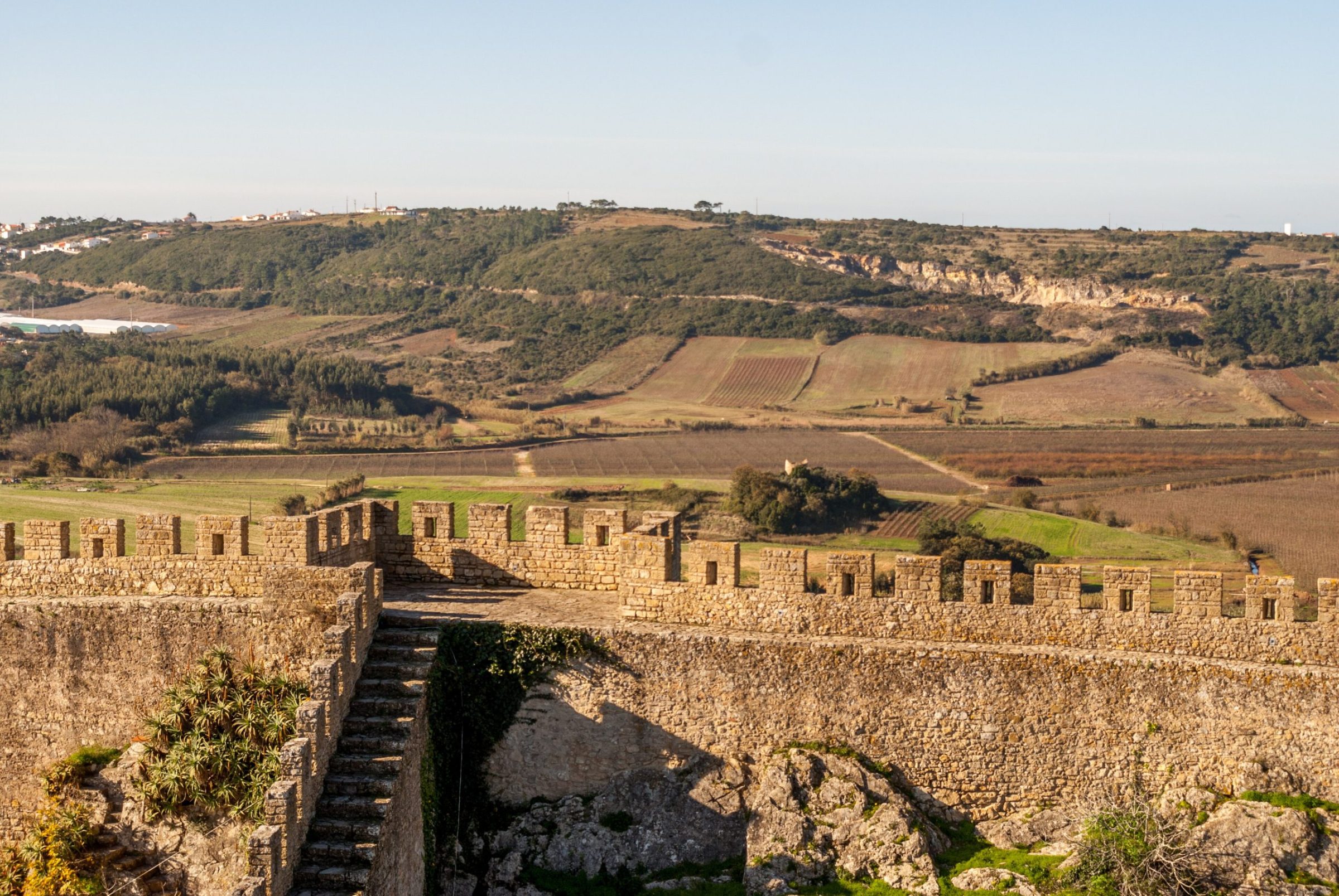 The medieval walls of Óbidos looking over the countryside in December