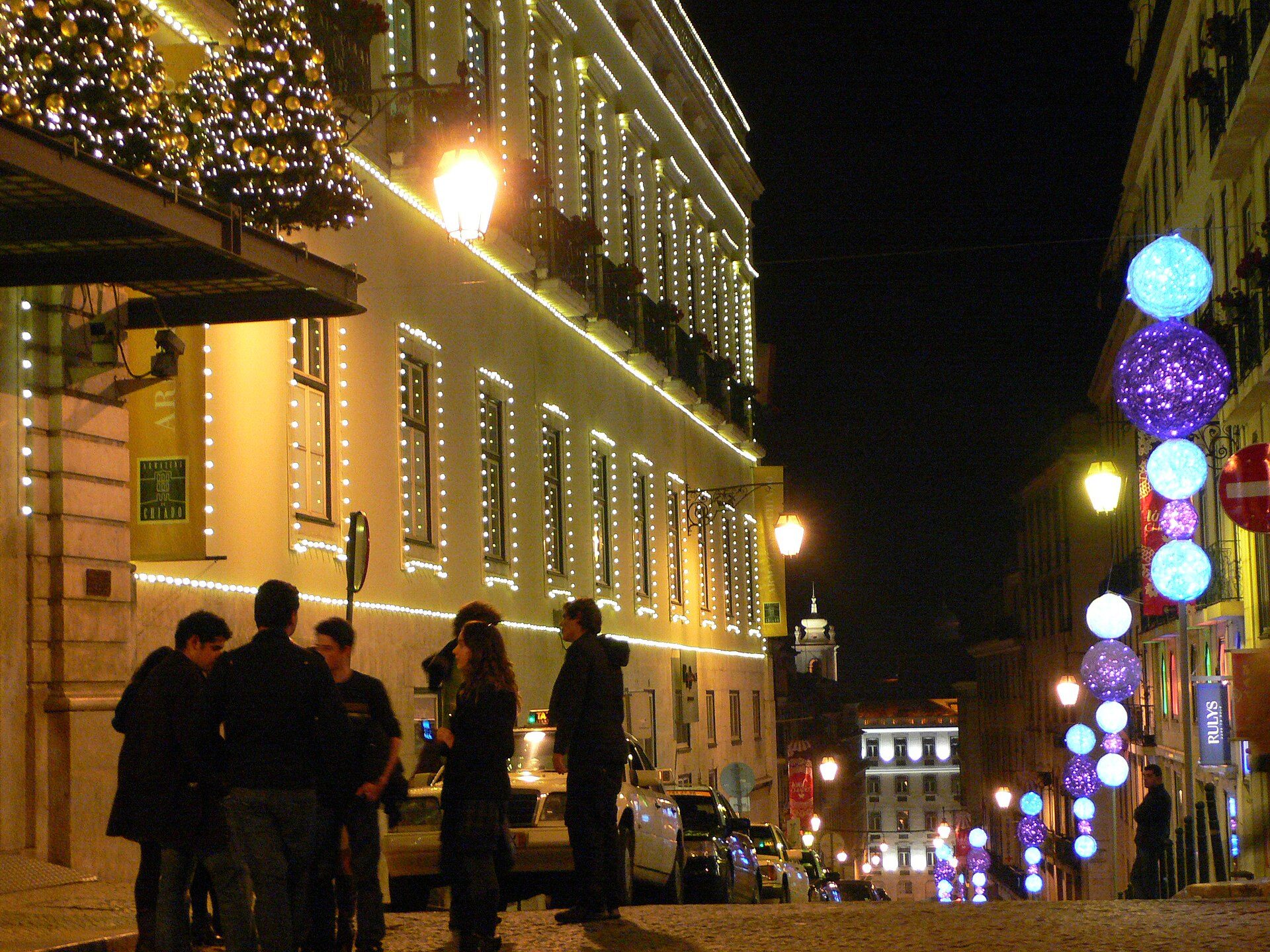 Christmas lights on the Armazéns do Chiado building in Lisbon at night